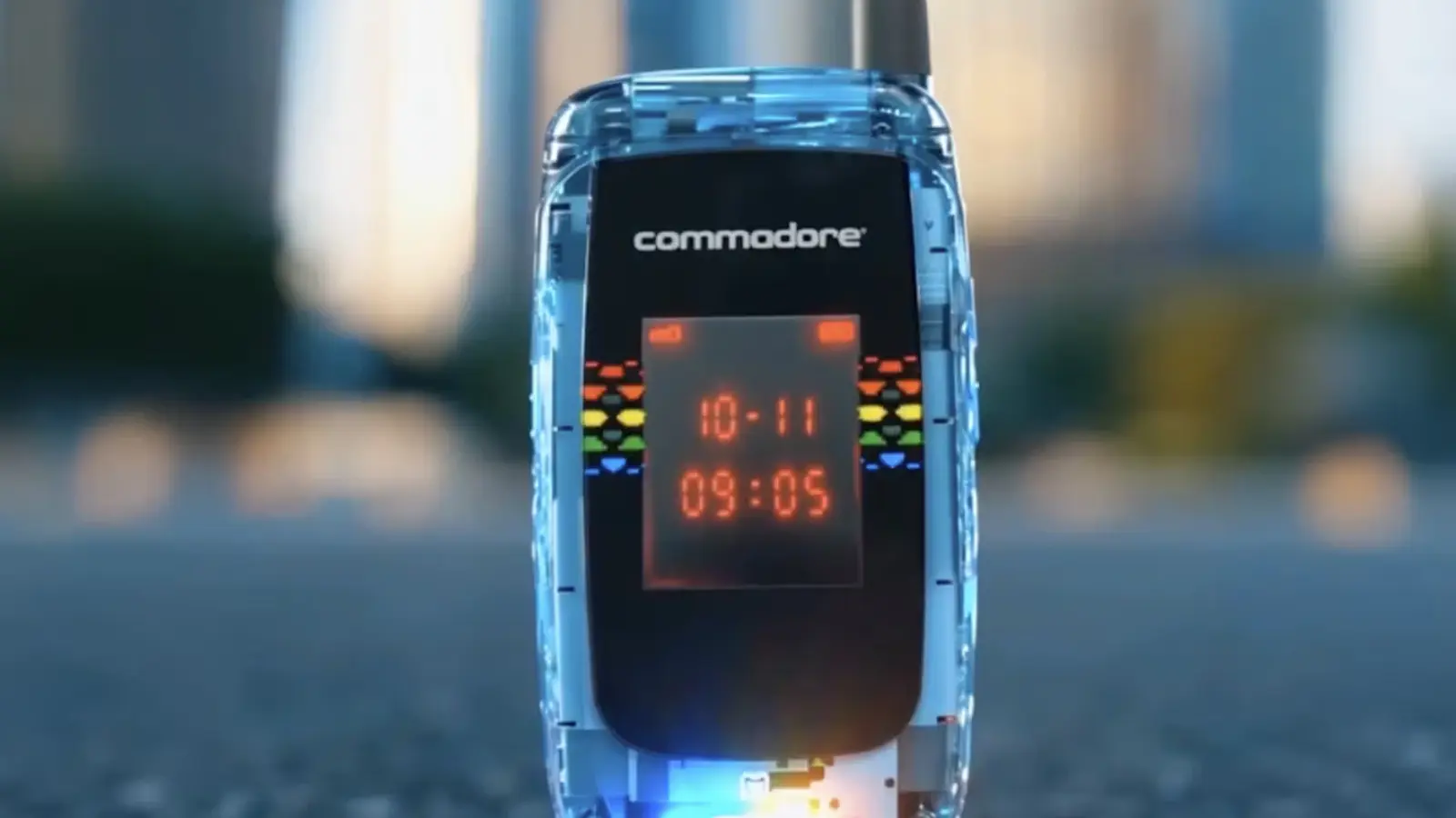 Studio product shot of the Commodore Callback 8020 flip phone in "BASIC Beige", half-opened on a minimalist concrete surface. The retro-styled rectangular outer LED screen glows red with numeric clock digits, reminiscent of a classic 1970s calculator.