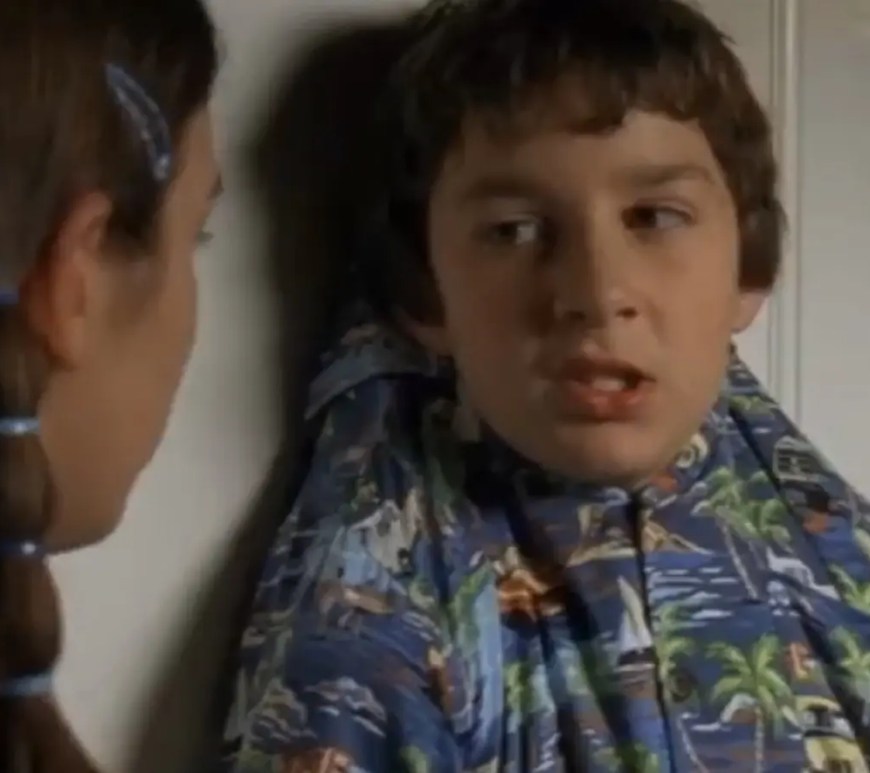 A vintage promotional image from the 2000 Disney Channel series Even Stevens, featuring a young Shia LaBeouf as Louis Stevens making a comedic face alongside Christy Carlson Romano as Ren Stevens against a vibrant, hyper-saturated Y2K background.