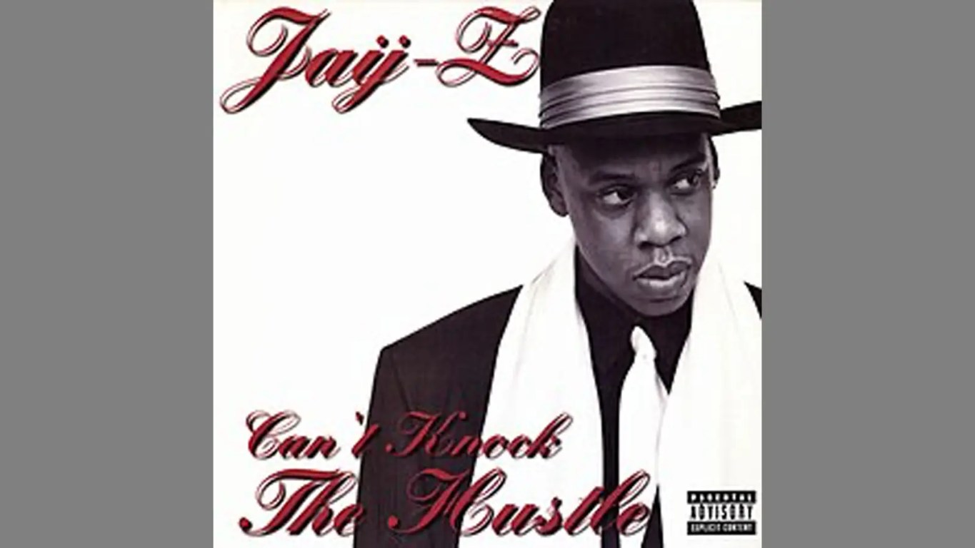 A close-up shot showcasing the official, minimalist black-and-white album cover art for JAY-Z's 1996 debut studio release, Reasonable Doubt, featuring the artist wearing a classic fedora and suit.