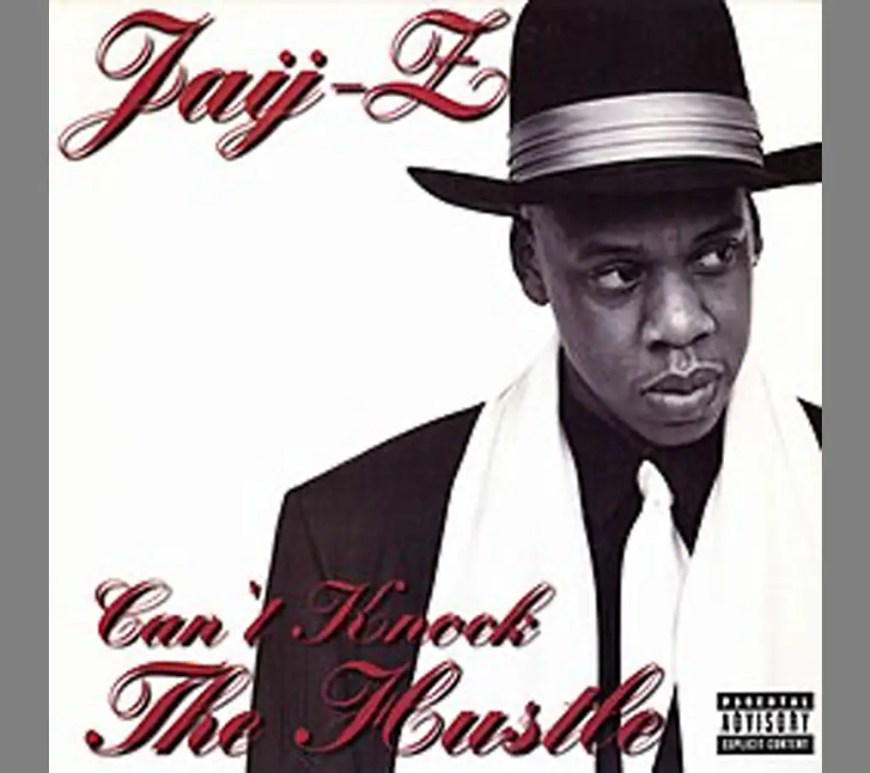 A close-up shot showcasing the official, minimalist black-and-white album cover art for JAY-Z's 1996 debut studio release, Reasonable Doubt, featuring the artist wearing a classic fedora and suit.