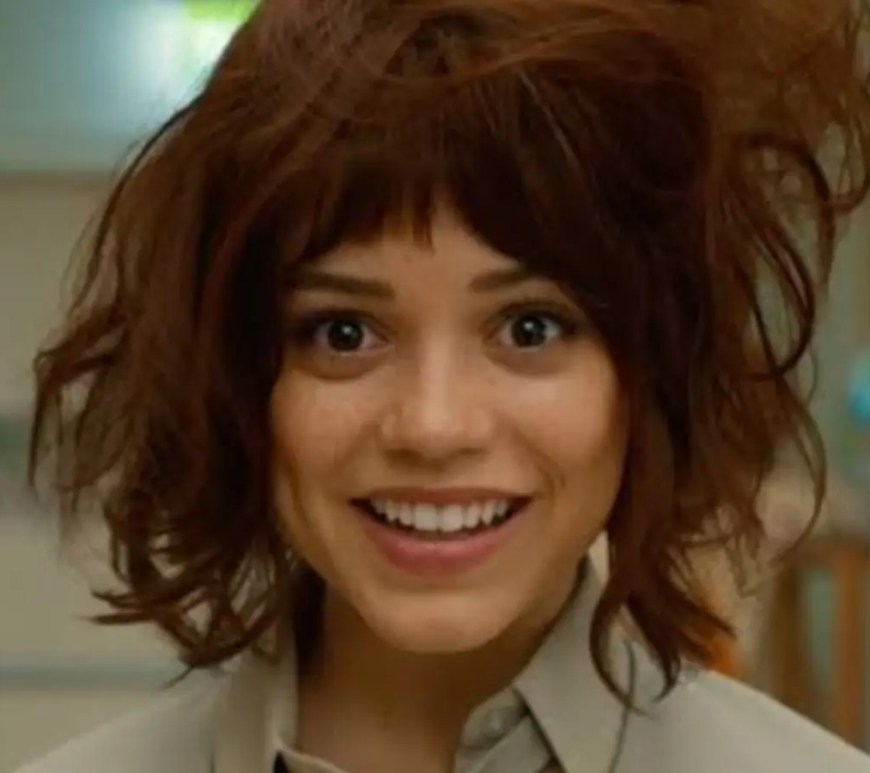 A clean, high-contrast video production still showing Jenna Ortega as Klara