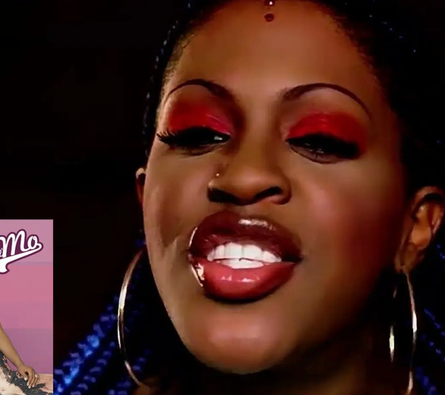 A clear wide shot of R&B singer Lil' Mo alongside rapper Fabolous on the vibrant, stylized set of a classic early-2000s music video.