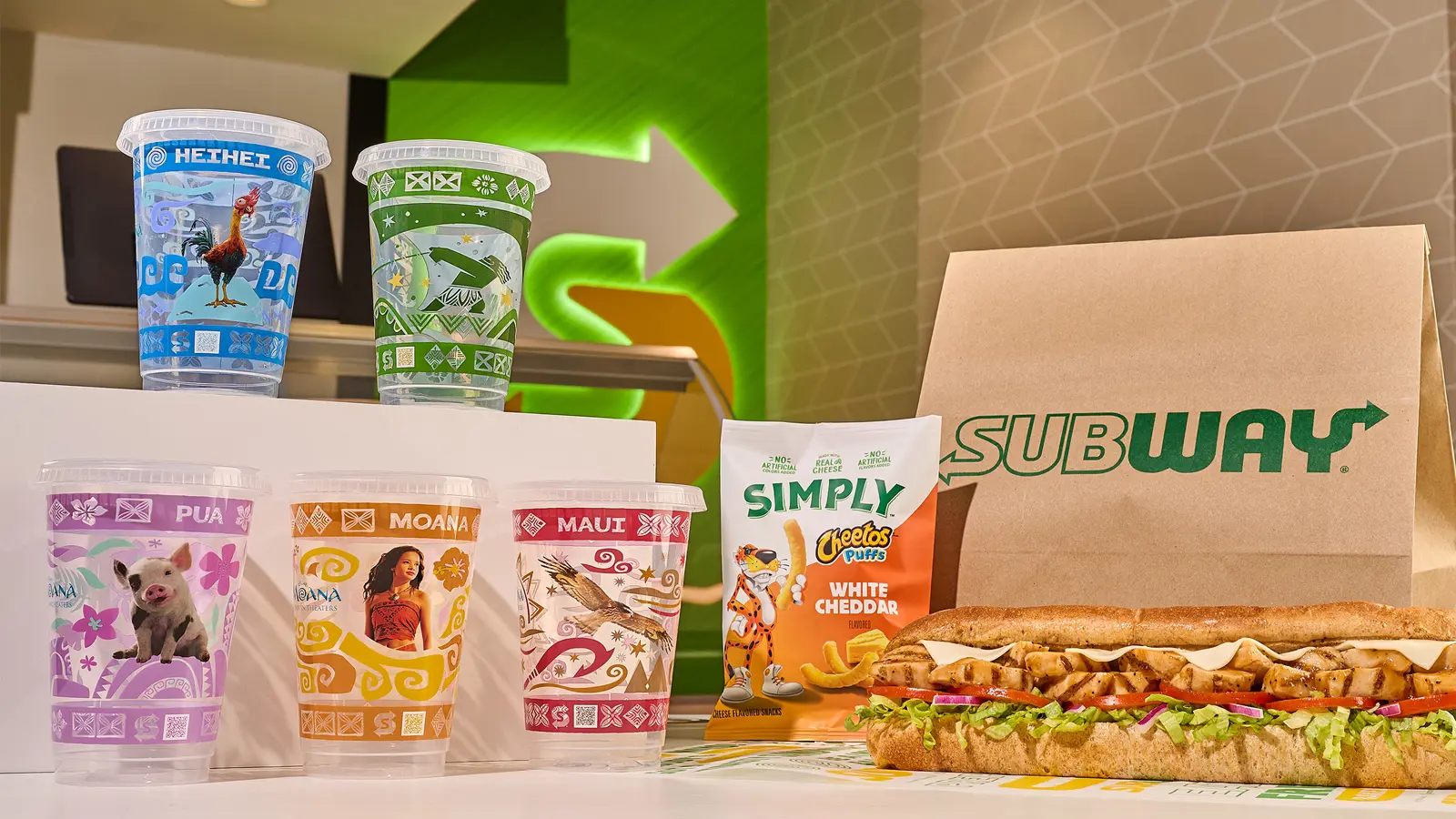 Subway Moana meal promotion featuring collectible character cups and Disney live-action film branding in restaurant display.