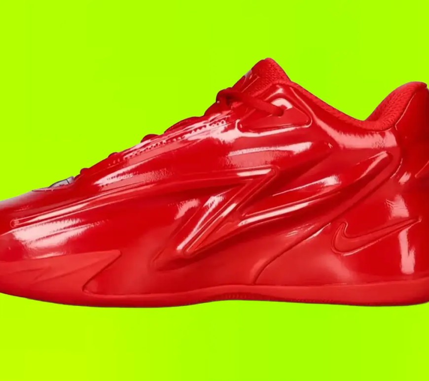 Nike KD 19 "Candy Apple" basketball sneaker in a vibrant University Red colorway featuring a sculpted upper, performance-focused design, and full-length cushioning against a lime green background