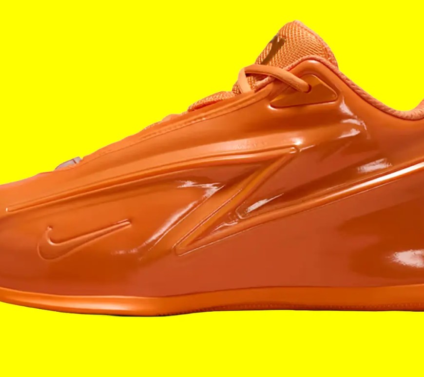 A high-resolution, profile studio product photograph of Kevin Durant's signature Nike KD 19 basketball shoes, showcasing the vibrant monochromatic 'Orange Crush' textile mesh upper accented by clean black and white branding contours around the Swoosh against a yellow background.
