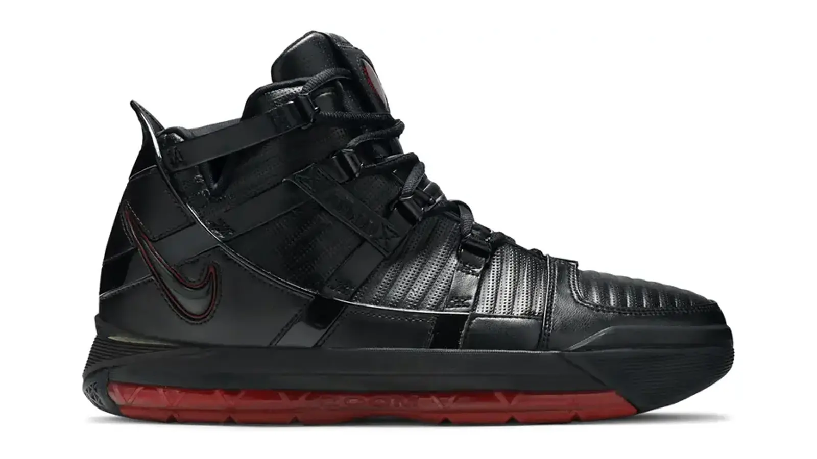 clean product profile shot showcasing the rugged, industrial leather shell, metallic eyelets, and visible full-length Zoom Air window of the 2005 Nike Zoom LeBron III basketball shoe.