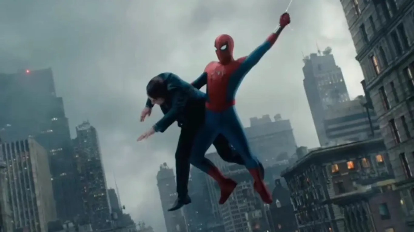 Cinematic trailer still from Spider-Man: Brand New Day featuring Spider-Man in his classic red and blue suit mid-air, web-swinging between modern glass skyscrapers in a sunlit city.