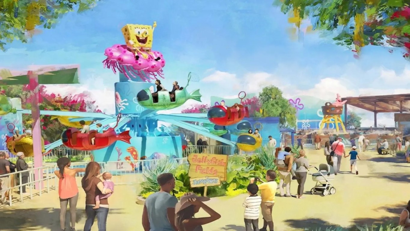 A vibrant, colorful concept rendering displaying the entrance to the SpongeBob SquarePants Bikini Bottom land at Universal Kids Resort, showcasing the Pineapple Paradise water play structure and child-friendly rides under a bright blue sky.