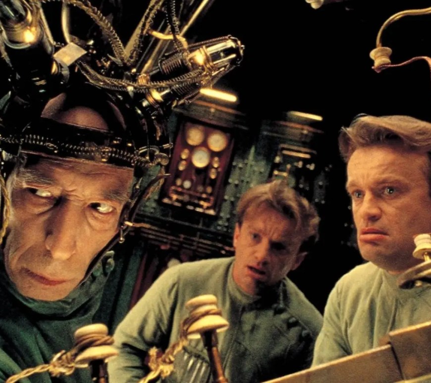 A dark green and amber wide-angle film still from the 1995 movie The City of Lost Children.
