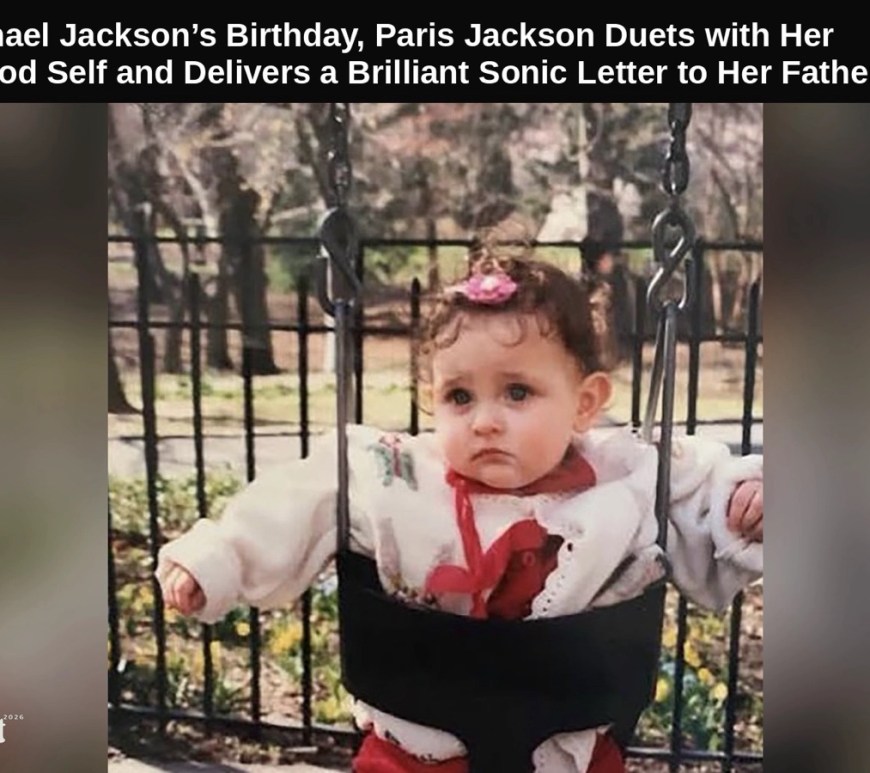 Baby Paris Jackson sits in a park swing wearing a white jacket with red accents and a pink bow in her curly hair, framed by a metal fence and bare trees, used as the single cover for her double release ‘The Breeze,’ a musical letter to her father Michael Jackson.