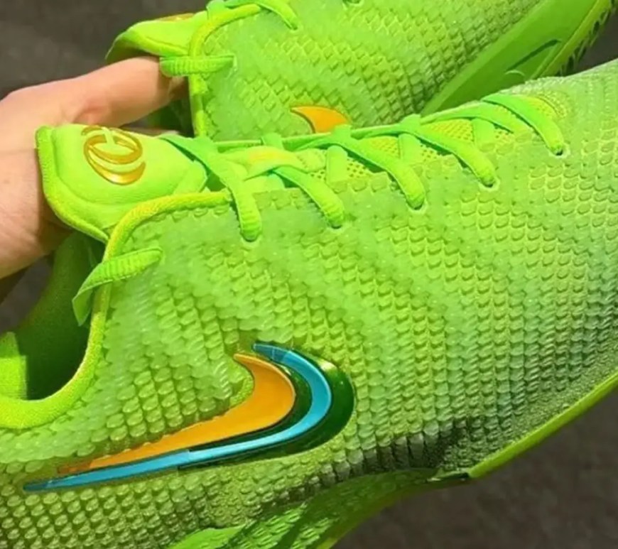 A close-up look at the Caitlin Clark Electric Green colorway reflecting a green upper and green laces with a metallic swoosh
